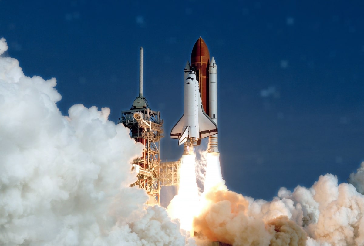 The launch of the space shuttle. With fire and smoke. Against the background of the starry sky. Elements of this image were furnished by NASA