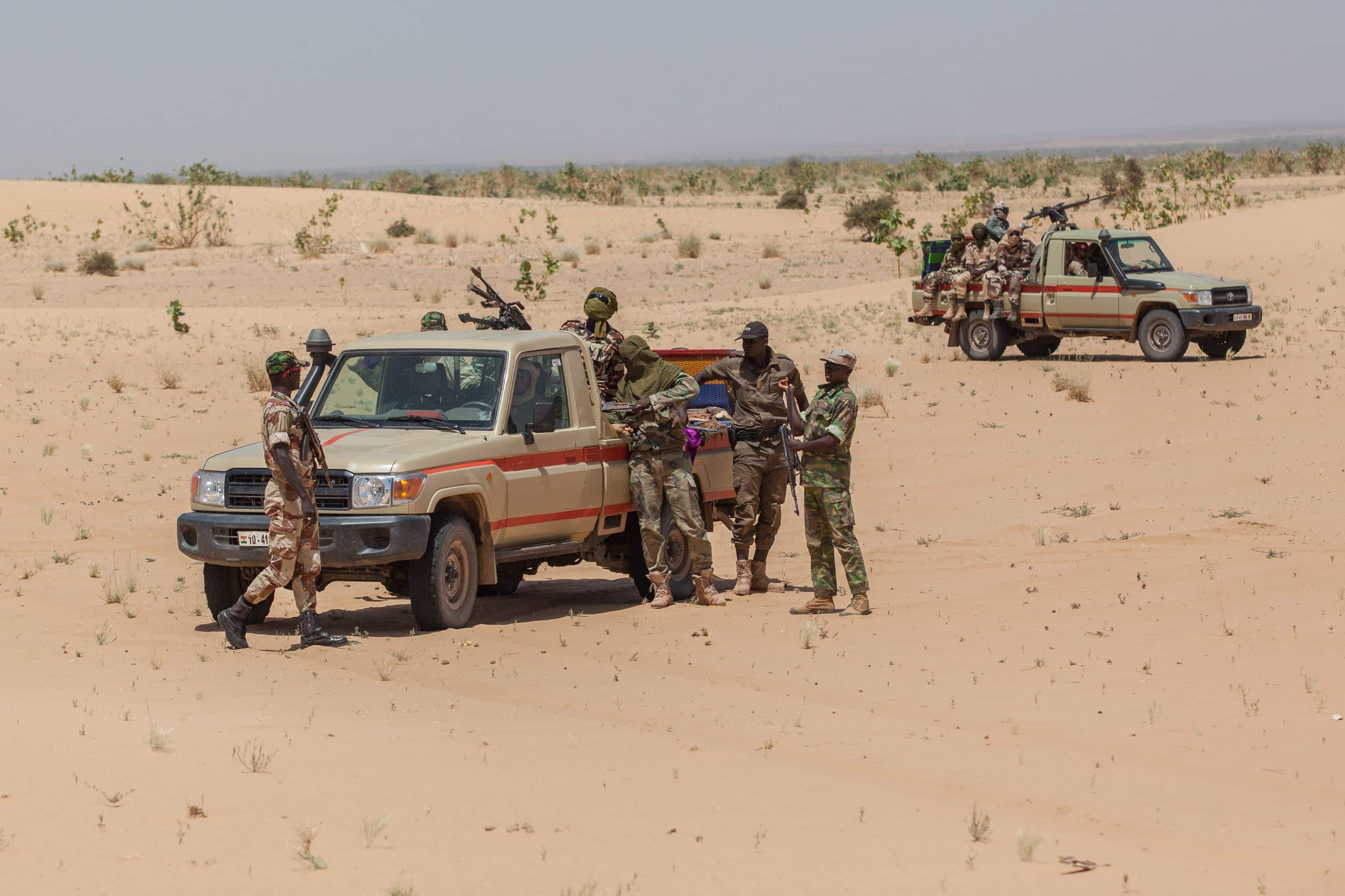 Niger - september 2013: Governmental military guard in North Africa Cars with armed soldiers desert border Libya Niger