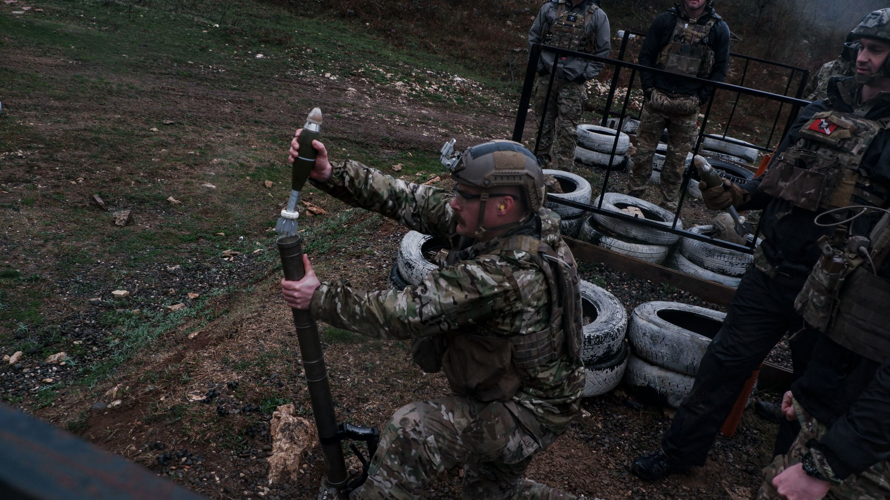 A Green Beret assigned to 10th Special Forces Group (Airborne) loads a 60-mm mortar round in Navenakhevi, Georgia, March 20, 2023. Combined training between U.S. Army Special Forces and Georgian Special Operations Forces increased anti-armor weapon systems and indirect fire interoperability. (U.S. Army photo by Spc. Jordan S. Worthy) (This photo has been altered for security purposes.)