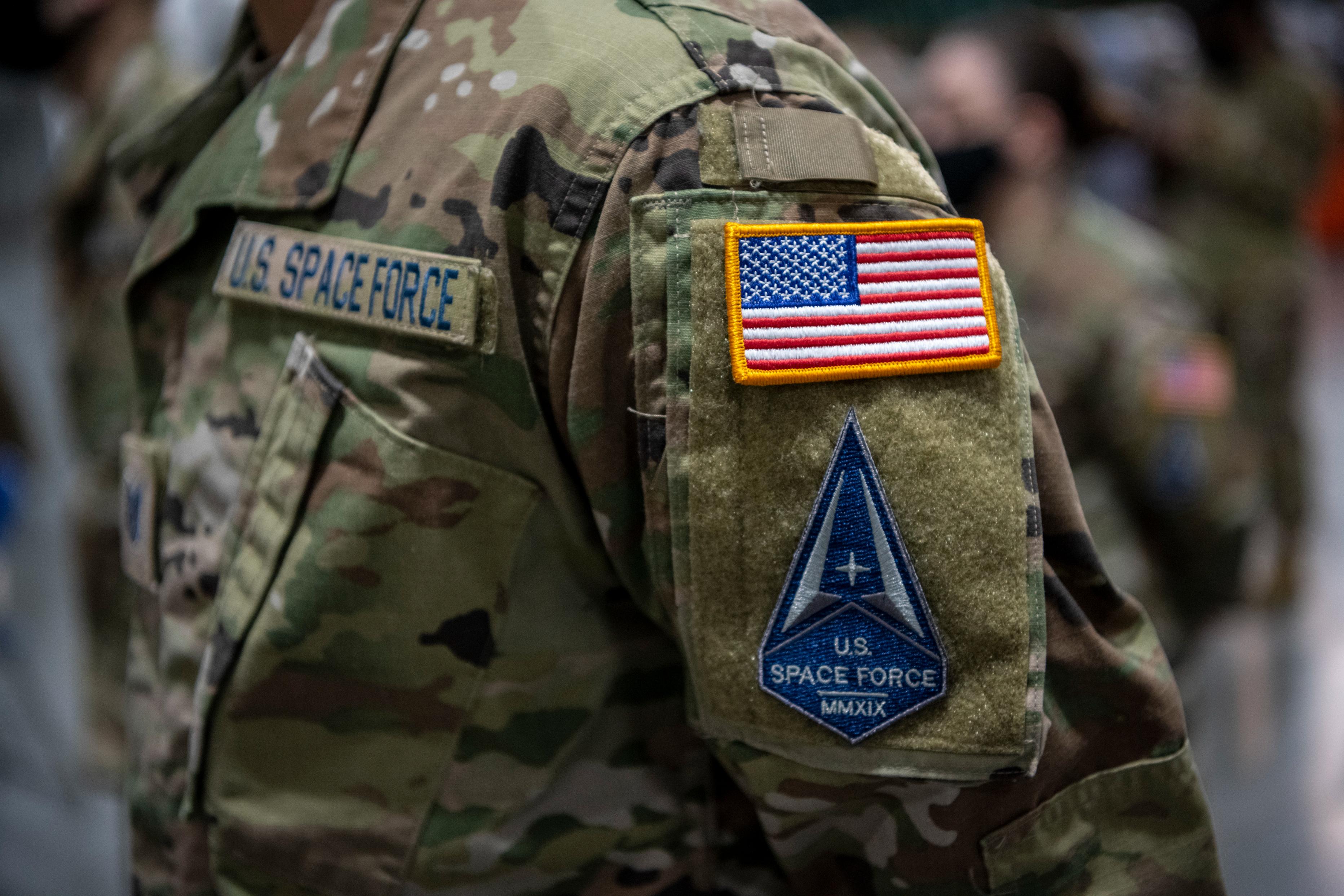 U.S. Airmen assigned to Travis Air Force Base, California, transition into the U.S. Space Force during a ceremony at the 621st Contingency Response Wing, Travis AFB, California, Feb. 12, 2021.