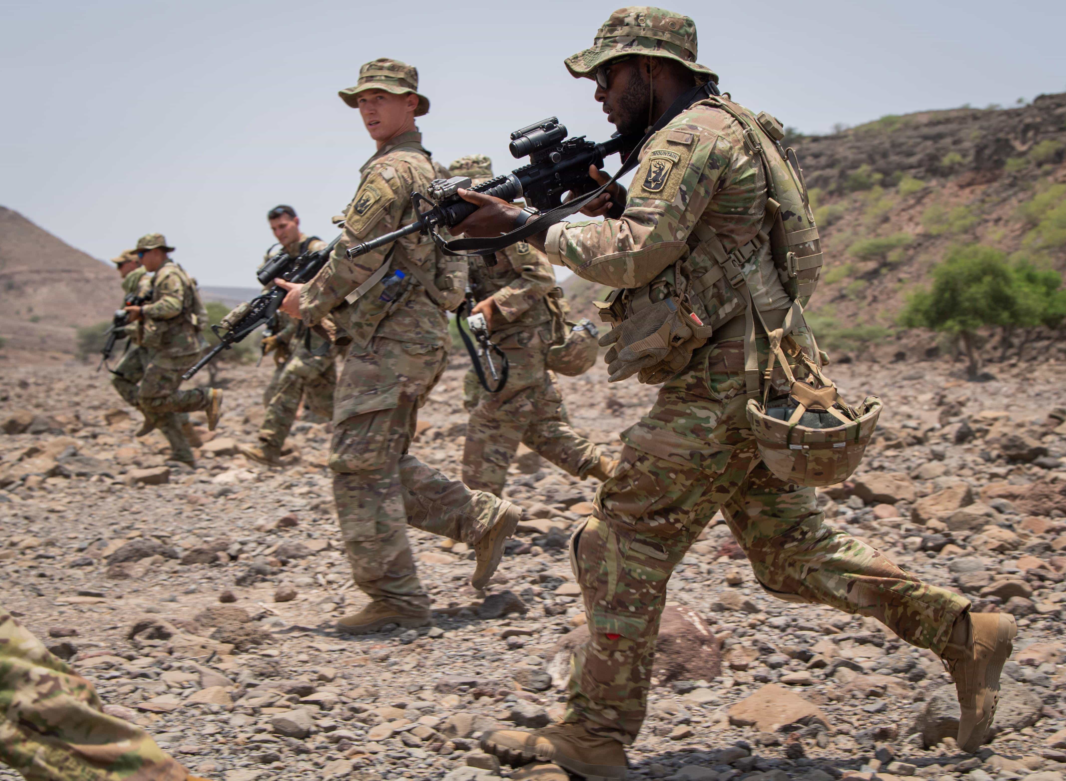 U.S. service members perform assigned movement tasks during a field training exercise at the Djiboutian Range Complex, Djibouti, Aug. 28, 2021. The exercise prepares service members for the French Desert Commando Course (FDCC) scheduled for mid-September.