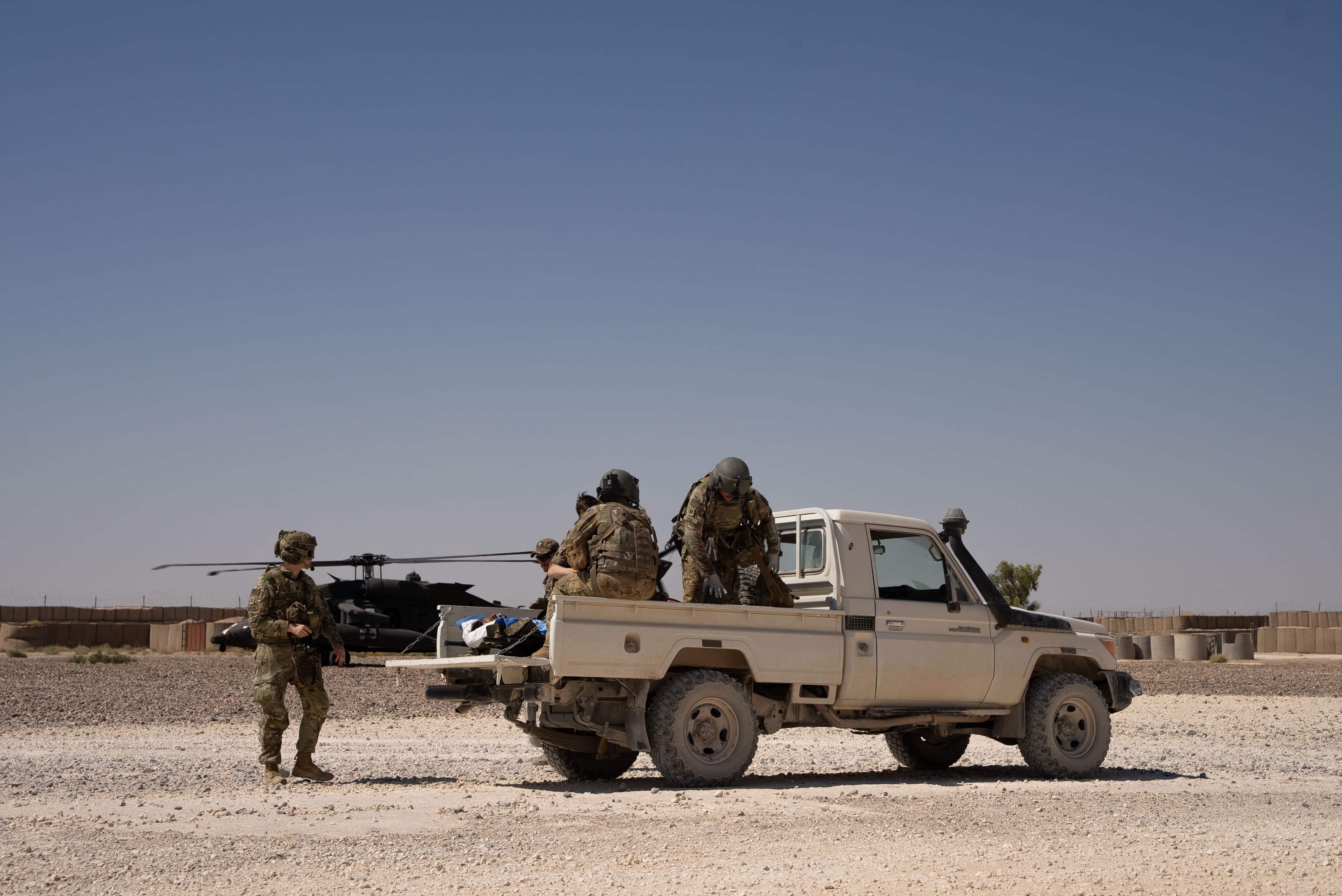 U.S. Army Soldiers dismount from the back of a pick-up truck